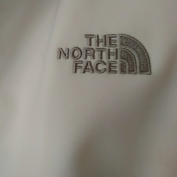 White north face jacket with grey trim at collar. - Picture 2 of 3